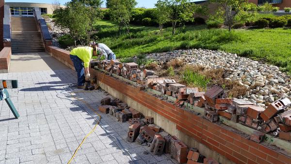 FSG workers build retaining wall